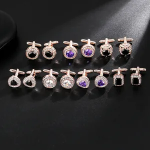 Collection of men's rose gold cufflinks with colorful zircon stones on grey background