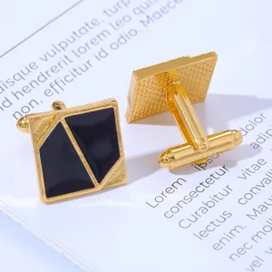 Macro shot of gold-plated square cufflinks with black enamel geometric design and bullet back