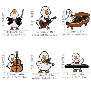 Set of 6 cute cartoon music duck enamel pins featuring violin, guitar and piano themes