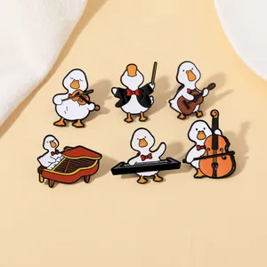 Detailed set of six cute cartoon duck enamel pins playing various musical instruments