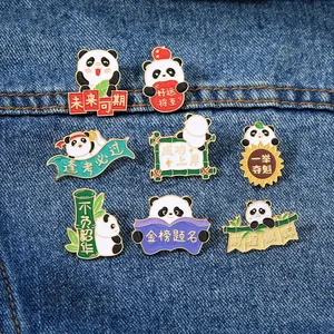 Detail of 8 cartoon panda enamel pins with motivational Chinese text on denim background