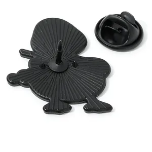 Back view of cute musical duck enamel pin with secure black rubber clutch and textured metal