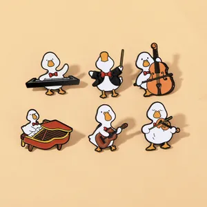Set of six cartoon duck enamel pins playing various musical instruments on a peach background