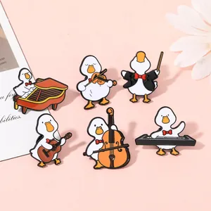 Detailed close-up of cute enamel duck brooches playing various musical instruments