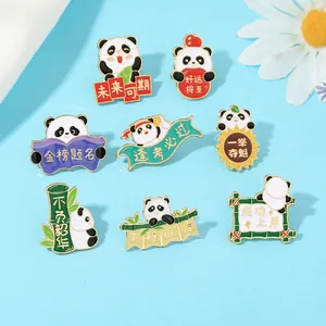 Close-up of enamel panda badges with inspirational Chinese text and golden metal edges