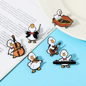 Close-up of cute cartoon musical duck enamel pins featuring various instruments and details