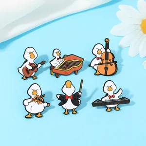 Detailed set of six cartoon duck enamel pins featuring various musical instruments
