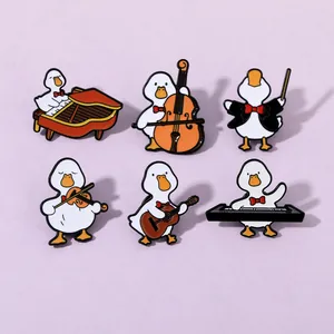 Set of six enamel pins featuring cute white ducks playing various musical instruments