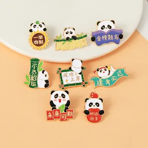 Macro shot of cartoon panda enamel pins with motivational Chinese calligraphy and gold edges