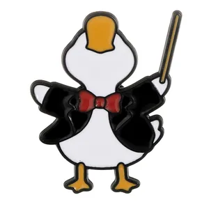 Cartoon enamel duck badge wearing tuxedo as music conductor with golden baton