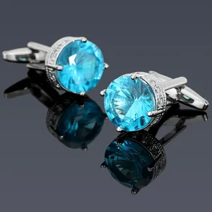 Macro view of blue zircon cufflinks with silver plating and micro-pave crystals