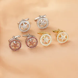 Detailed macro view of three pairs of rhinestone star cufflinks in gold and silver finishes