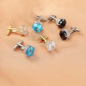 Men's round cufflink set with blue, white, and black zircon stones on champagne silk