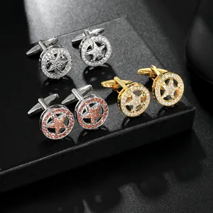Detailed macro view of three pairs of rhinestone star cufflinks in gold and silver plating
