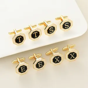 Gemelos octagonales dorados con esmalte negro, borde de cristales y letras grabadas