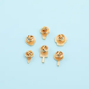 Detailed back view of six gold-toned enamel pins featuring butterfly clutch backings