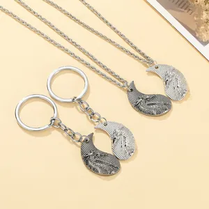 Retro dragon puzzle necklace and keychain set in silver and gunmetal finish