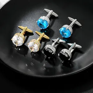 Detailed view of elegant round gold and silver cufflinks with blue, white, and black stones