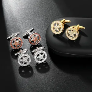 Detailed set of star-shaped cufflinks in gold and silver with sparkling rhinestones