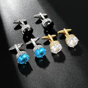 Detailed close-up of luxury round cufflinks set with blue, black and champagne zircon stones