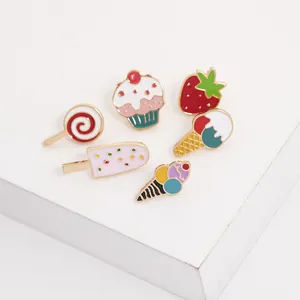 Detailed set of colorful enamel pins featuring cute strawberry, ice cream and cupcake shapes
