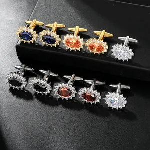 Macro shot of luxury oval crystal cufflinks with sparkling rhinestone halos in a gift box