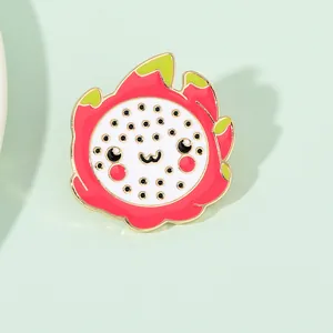 Detail of cartoon dragon fruit enamel pin with cat face and colorful drip oil finish