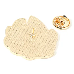 Golden dragon fruit badge back with butterfly clutch and textured floral metal finish