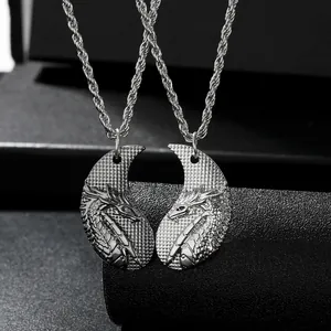 Detail of silver alloy dragon scale pendants on two intertwining couple necklaces