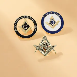 Close-up of Masonic pins featuring compass, square, and Ancient Free and Accepted Masons text