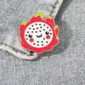 Cute cartoon pitaya enamel brooch with smiling face pinned on blue denim jacket