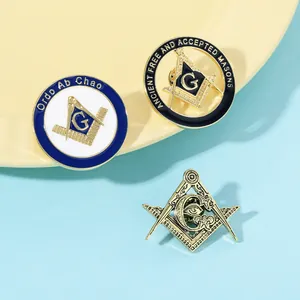 Detailed view of Masonic badges with compass logo and Ordo Ab Chao latin motto engraving