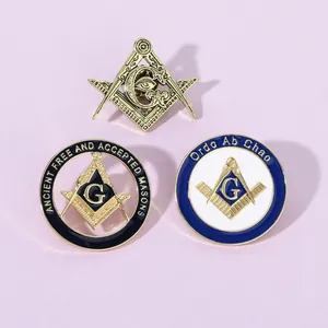 Detailed macro view of three Masonic enamel badges with gold plating on light purple surface