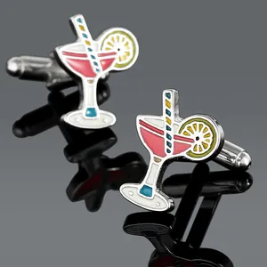 Pair of creative cocktail glass cufflinks with pink enamel liquid and straw detail