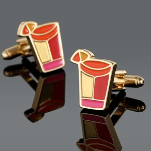 Macro shot of colorful enamel cocktail glass cufflinks with gold metal finish