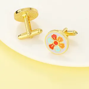 Classic round French cufflinks with vintage floral enamel patterns in a gold setting