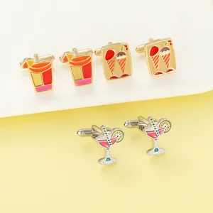 Detailed close-up of colorful enamel cufflinks featuring cocktail and ice cream motifs