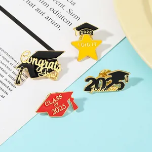 Detailed close-up of 2025 graduation enamel pins set featuring black caps and golden stars