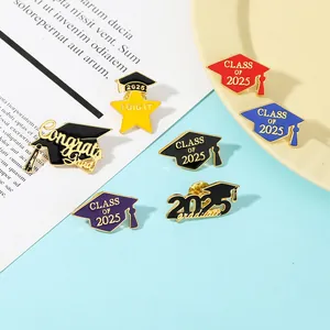 Detail of Class of 2025 enamel graduation pins featuring mortarboards and gold stars