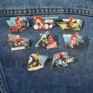 Detailed set of eight sport-themed metal enamel pins on blue denim fabric
