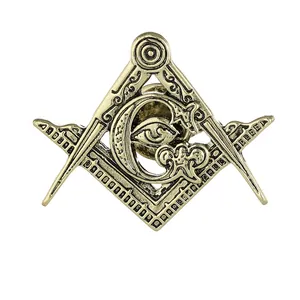 Vintage gold Freemasonry emblem brooch featuring square, compass, and eye detail