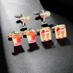 Detailed close-up of fashion cufflinks with cocktail cup and ice cream enamel designs