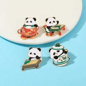 Set of four panda enamel pins featuring Sichuan hot pot, mahjong, tea and go board motifs