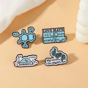 Close-up of science enamel pins featuring math formulas and chemical DNA structures