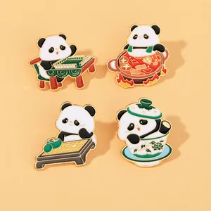 Detailed close-up of four cute cartoon panda enamel pins with Sichuan culture themes