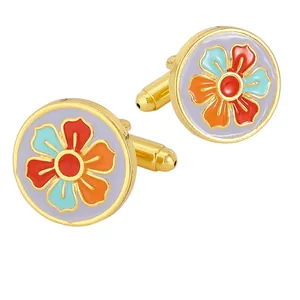 Golden round cufflinks for men featuring colorful floral enamel patterns in a classic design