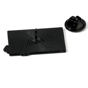 Black enamel rectangular metal badge showing single pin back and butterfly clutch closure