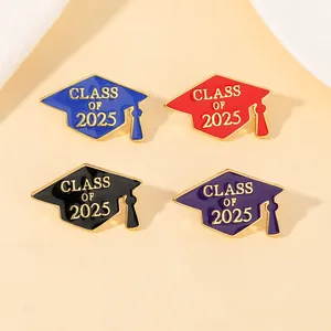 Detail of four colorful Class of 2025 graduation cap pins with gold plated finish
