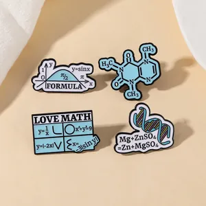 Detailed view of four science and math enamel pins featuring caffeine and DNA formulas