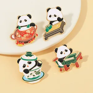 Detailed close-up of cute panda enamel pins featuring traditional Chinese cultural scenes
